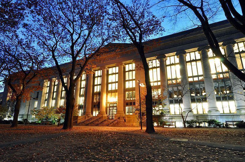 Large large harvard law school library in langdell hall at night